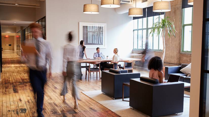 People walking around an office