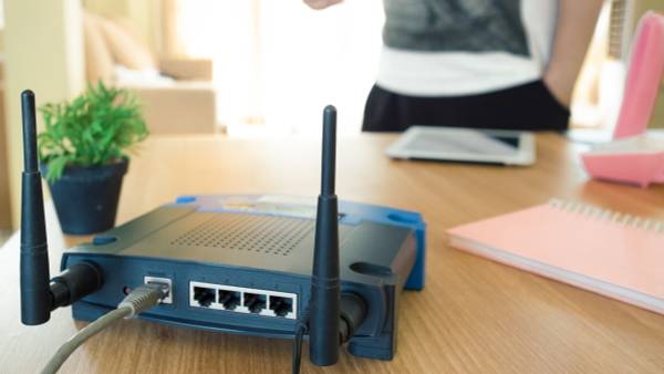 A Wi-Fi router on a table.