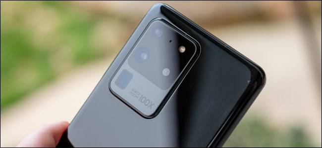 Person using Android smartphone back camera as webcam on Windows 10