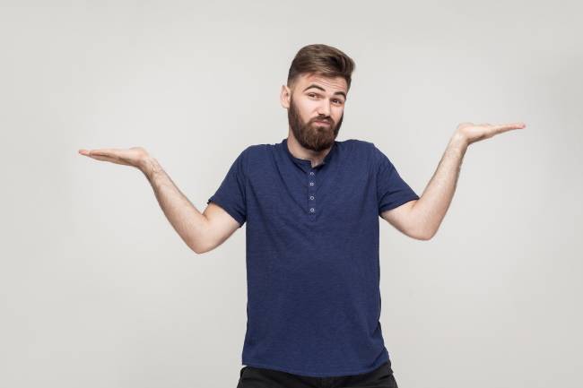 A man giving an exaggerated shrug.