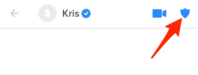 Tap the shield icon at the top-right corner in Tinder.