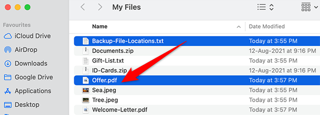 Hold down Command and click a file in Finder.