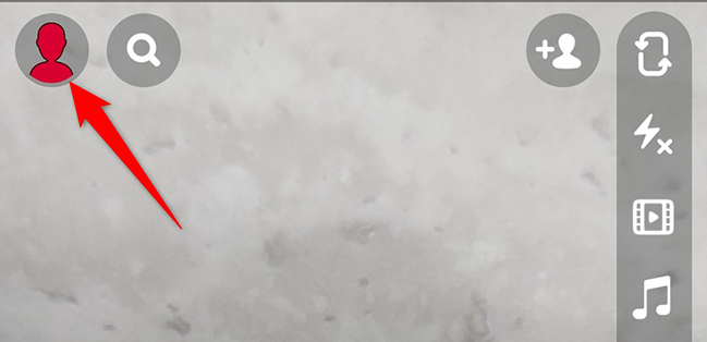 Tap the user icon in the top-left corner of Snapchat.