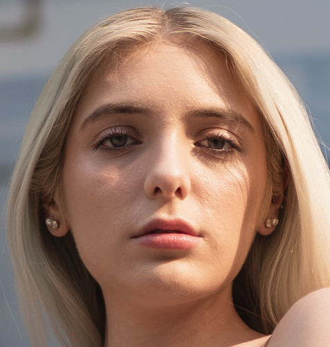 A woman's face before frequency separation editing.