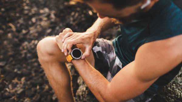 Runner with smartwatch.