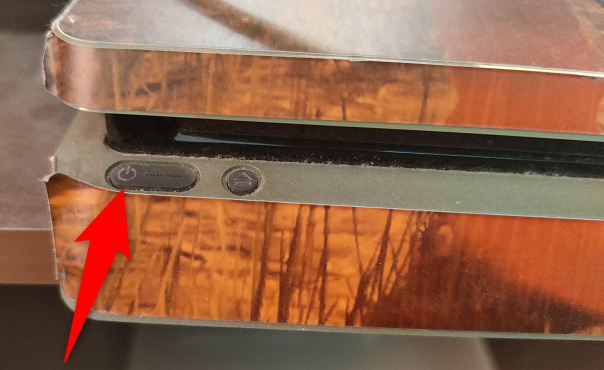 Press the Power button on the PS4.