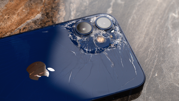 An iPhone with broken back glass.