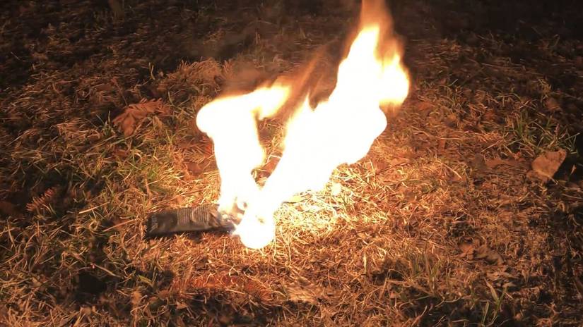 A phone battery on fire. A phone battery on fire.