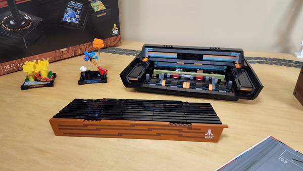 The top of a LEGO Atari build next to the bottom half