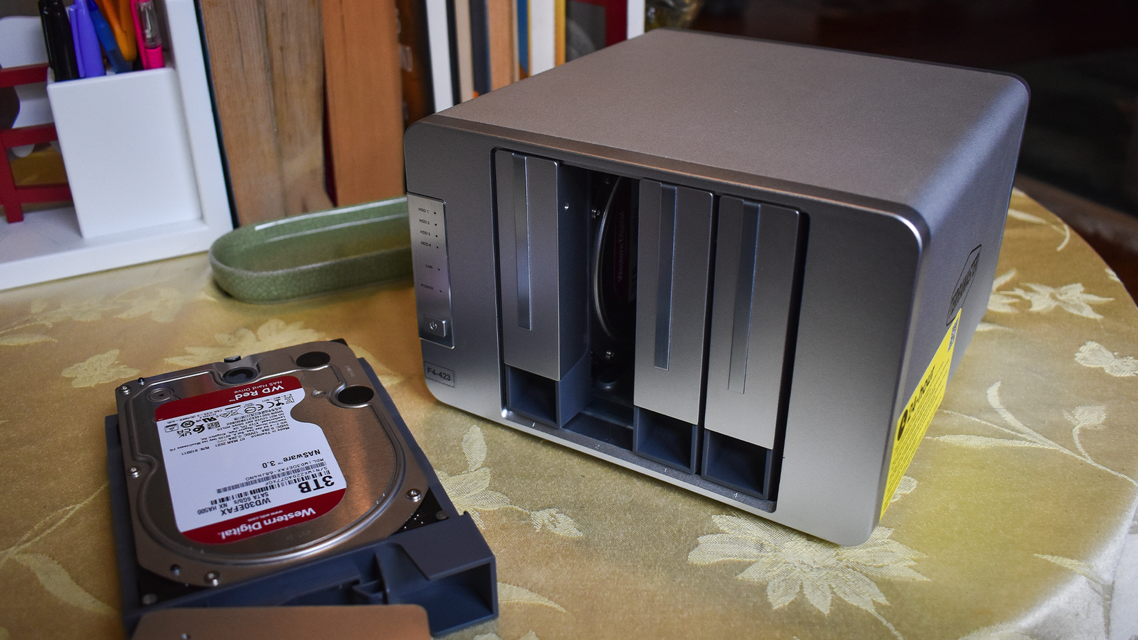 TerraMaster F4-423 on a table with a hard drive removed.