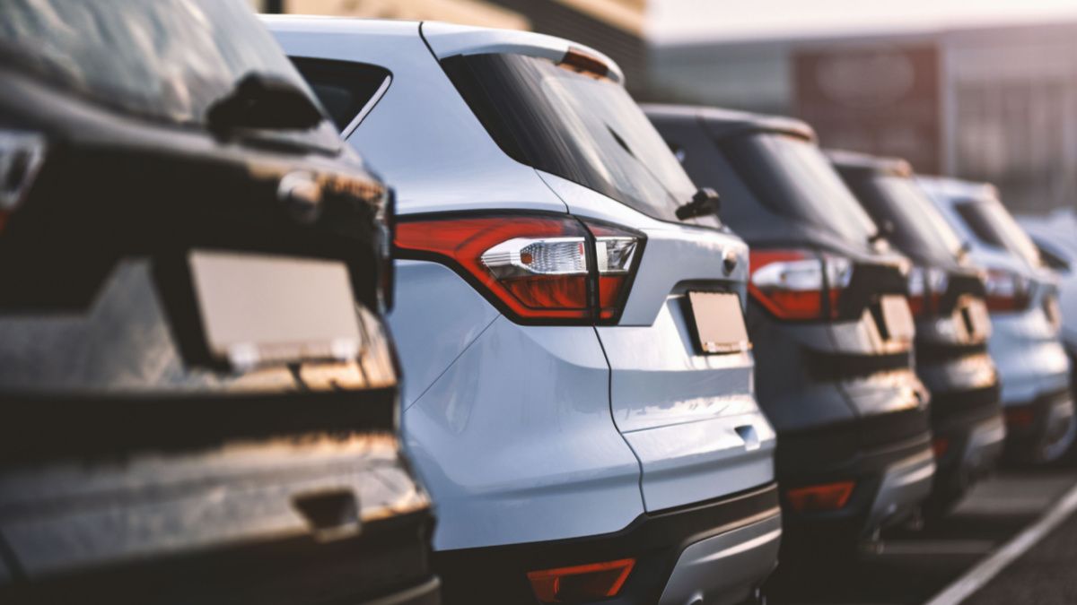 Cars lined up in a parking lot.