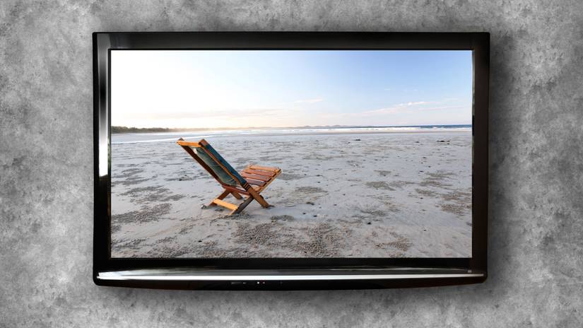 A plasma TV on a gray wall.