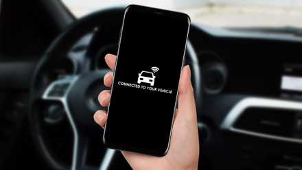 The woman connected her smartphone and app to the car using WiFi.