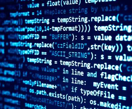 Closeup of a computer screen showing lines of programming language.