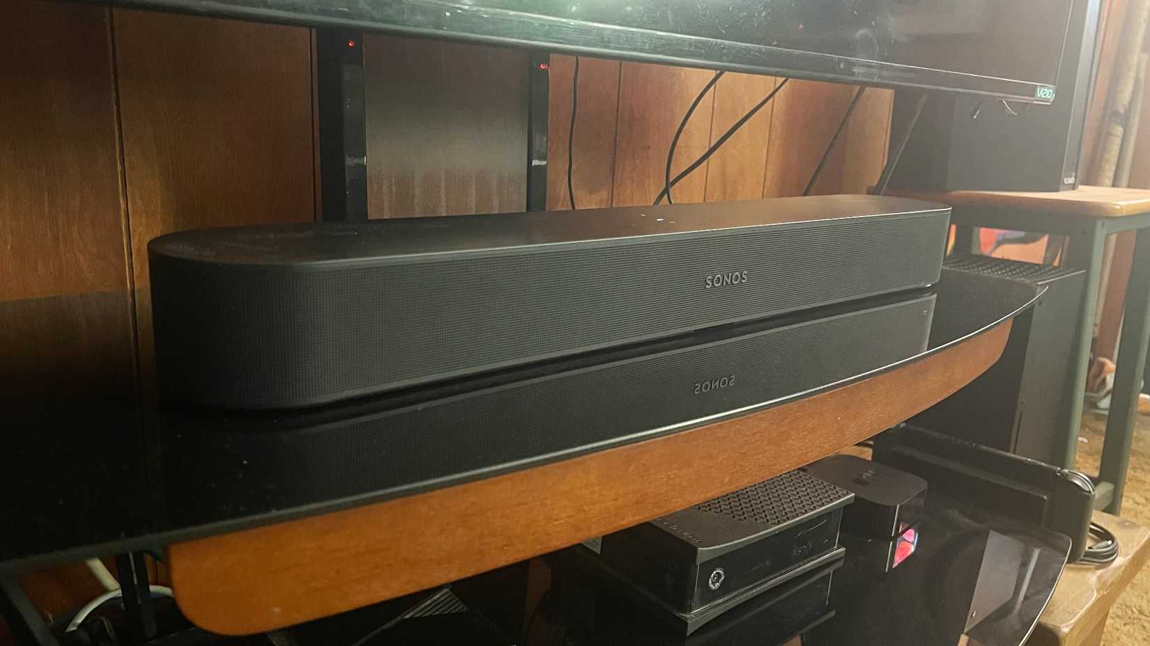 A Sonos Beam with TV above.