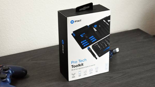 iFixit Pro Tech Toolkit on mantle next to PS4 controller