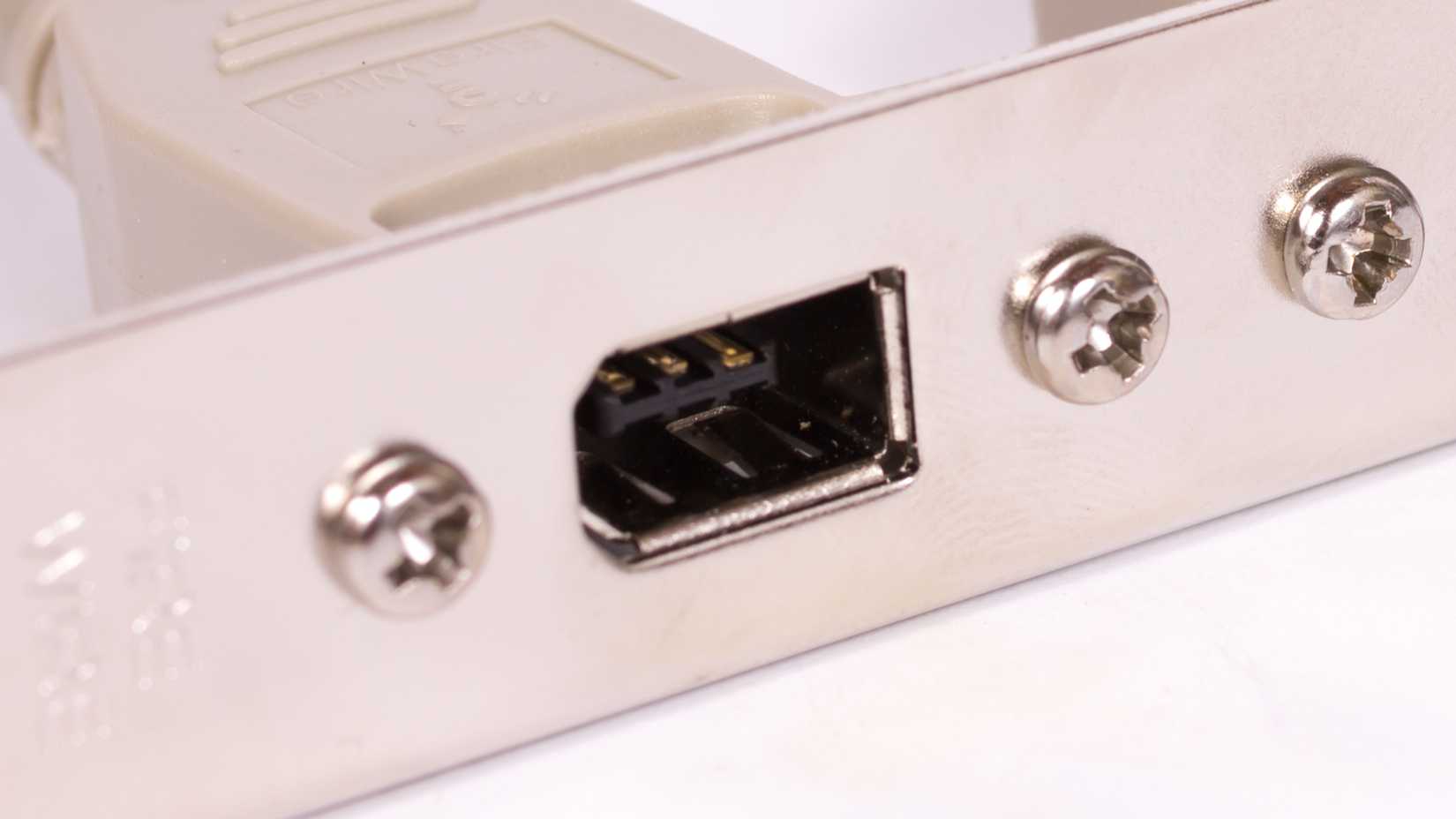 Firewire port on a vintage computer expansion card.