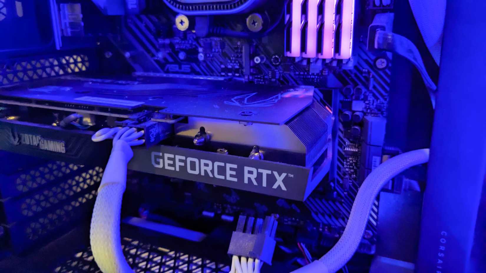 A Geforce RTX 3050 Ti GPU inside a computer tower.