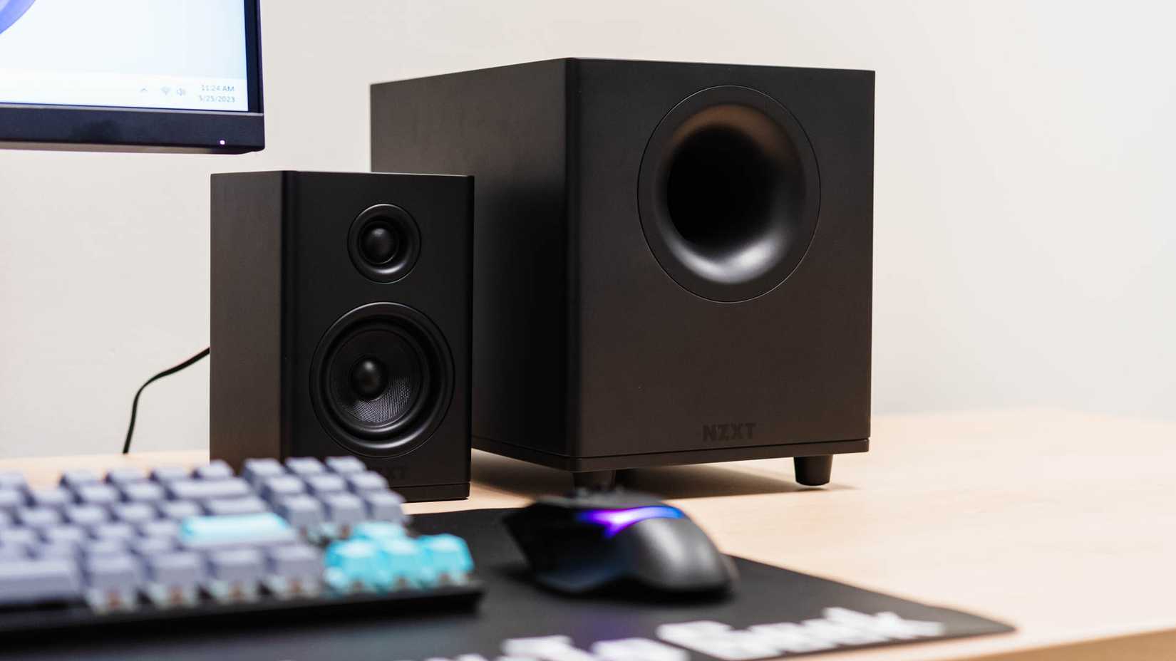 Desk set up with the NZXT Relay Subwoofer and a Relay Speaker.