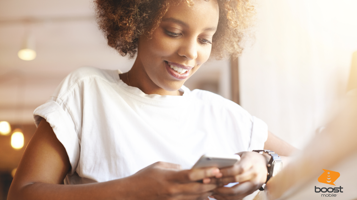 Woman using cell phone indoors