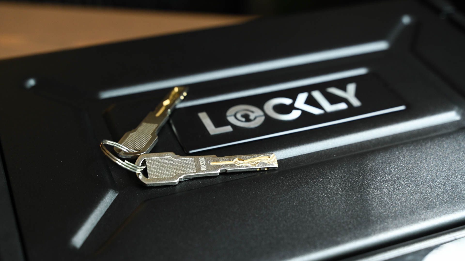 Keys laid on top of the Lockly Smart Safe.