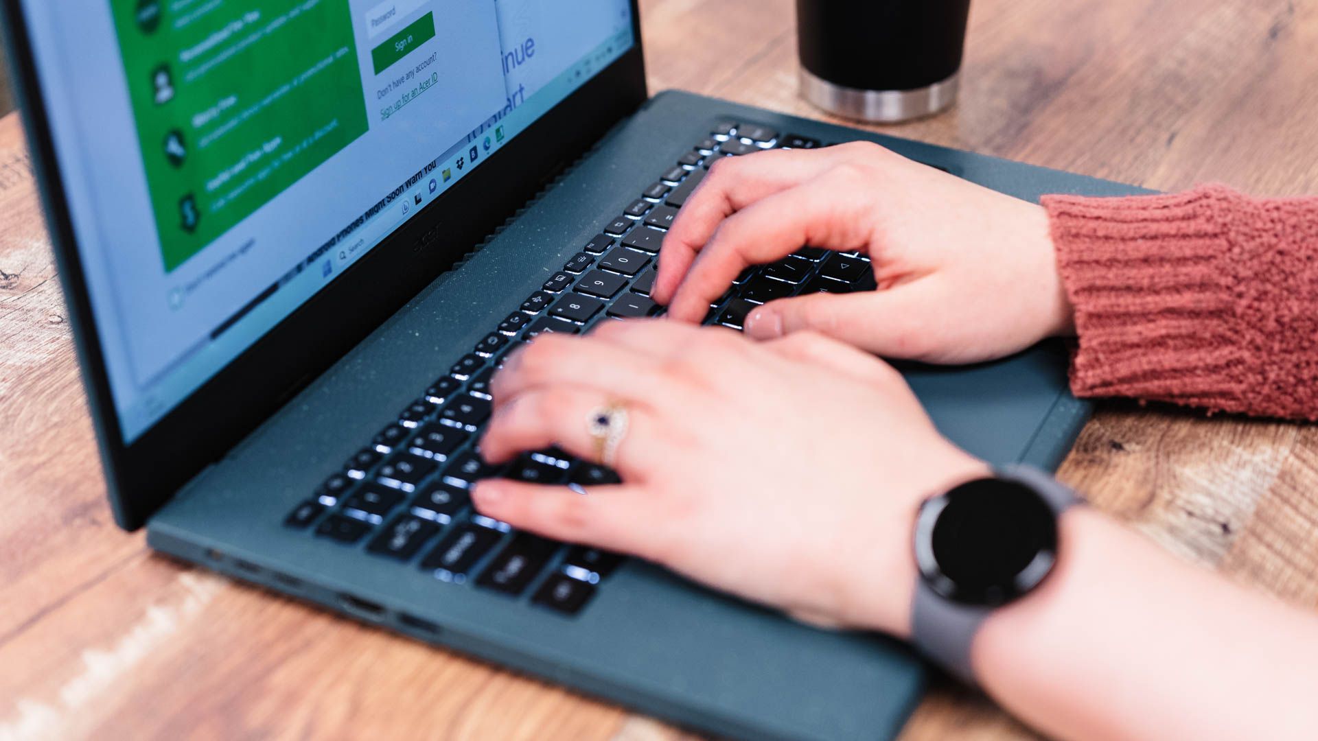 Person typing on the keyboard of the Acer Aspire Vero 15 laptop.