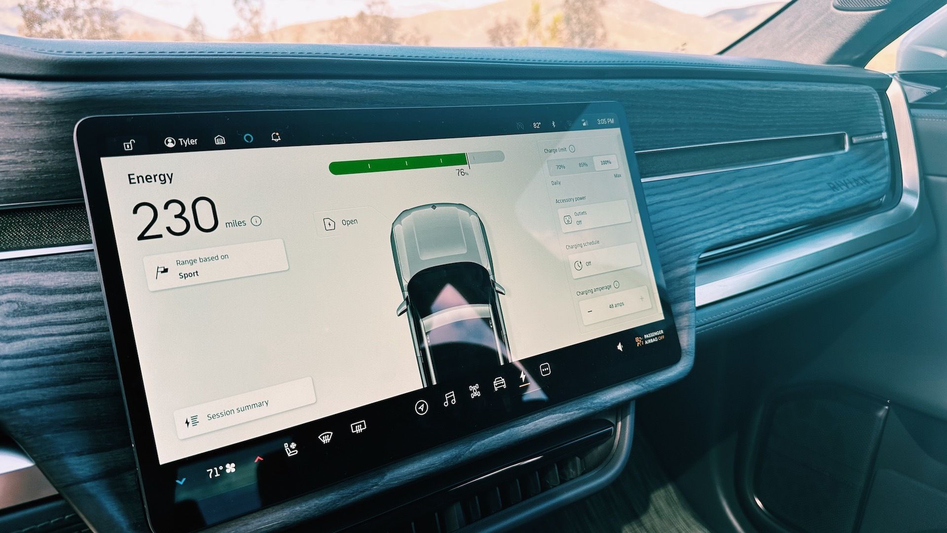 Showing Rivian R1T's 15-inch screen with 230 miles of range.