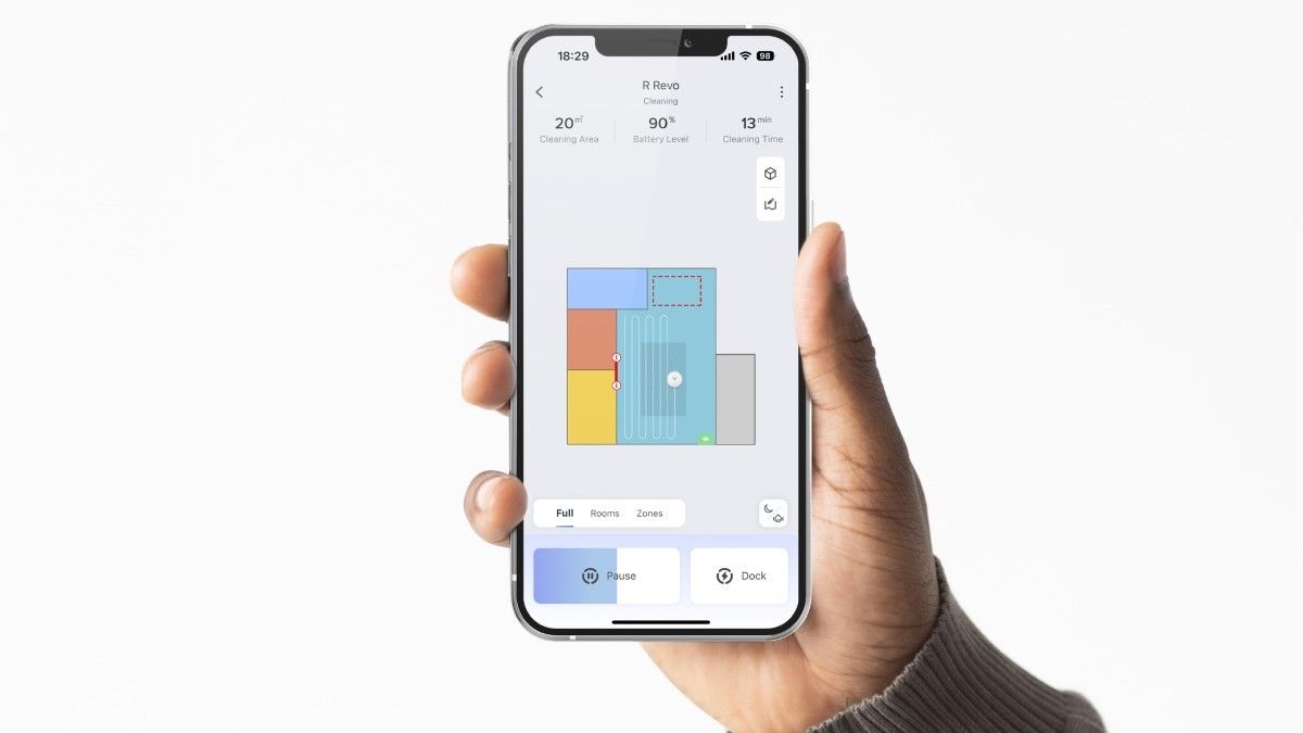 Person Holding a Phone and Using the Roborock App 