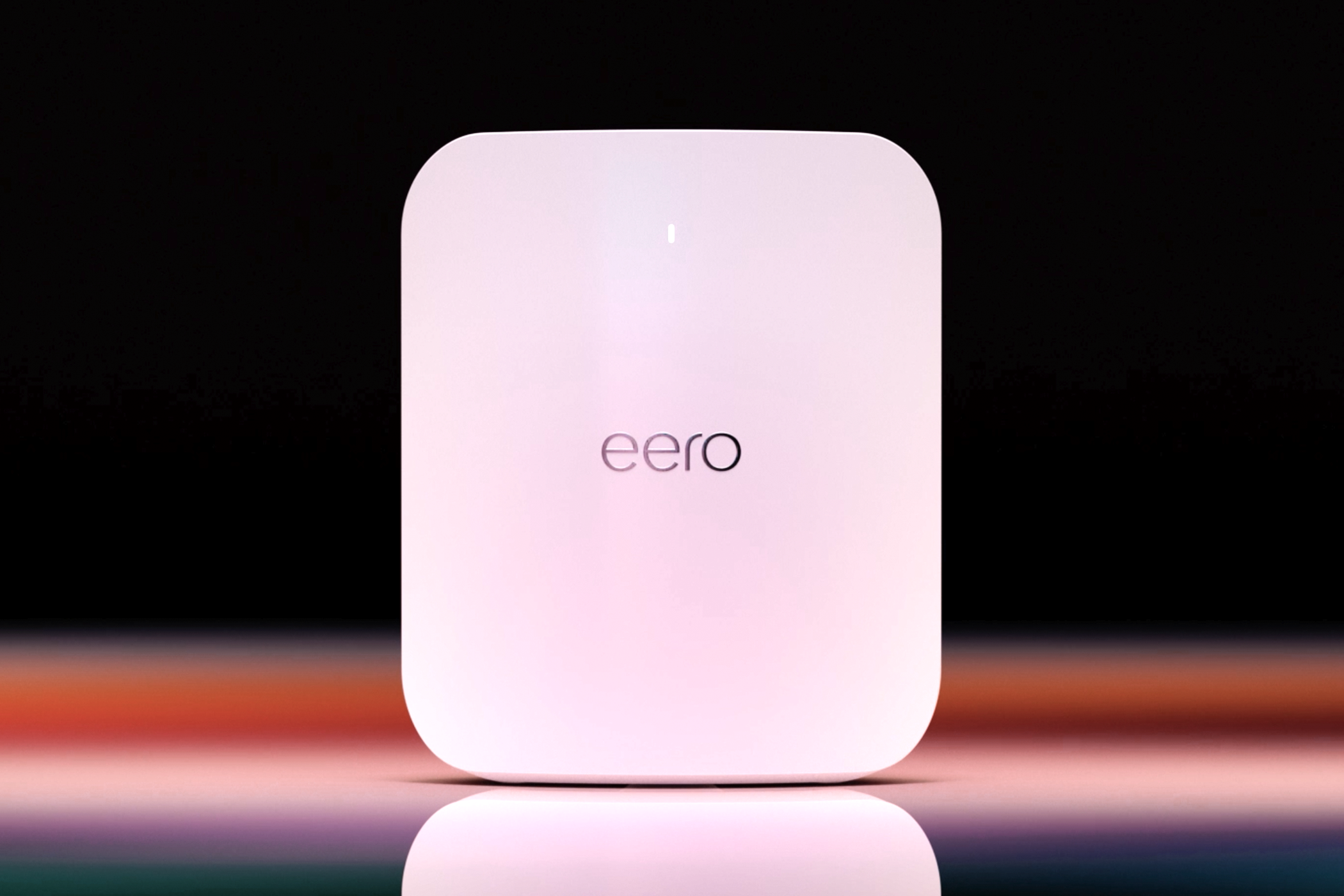 The Eero Max 7 router on a black background.