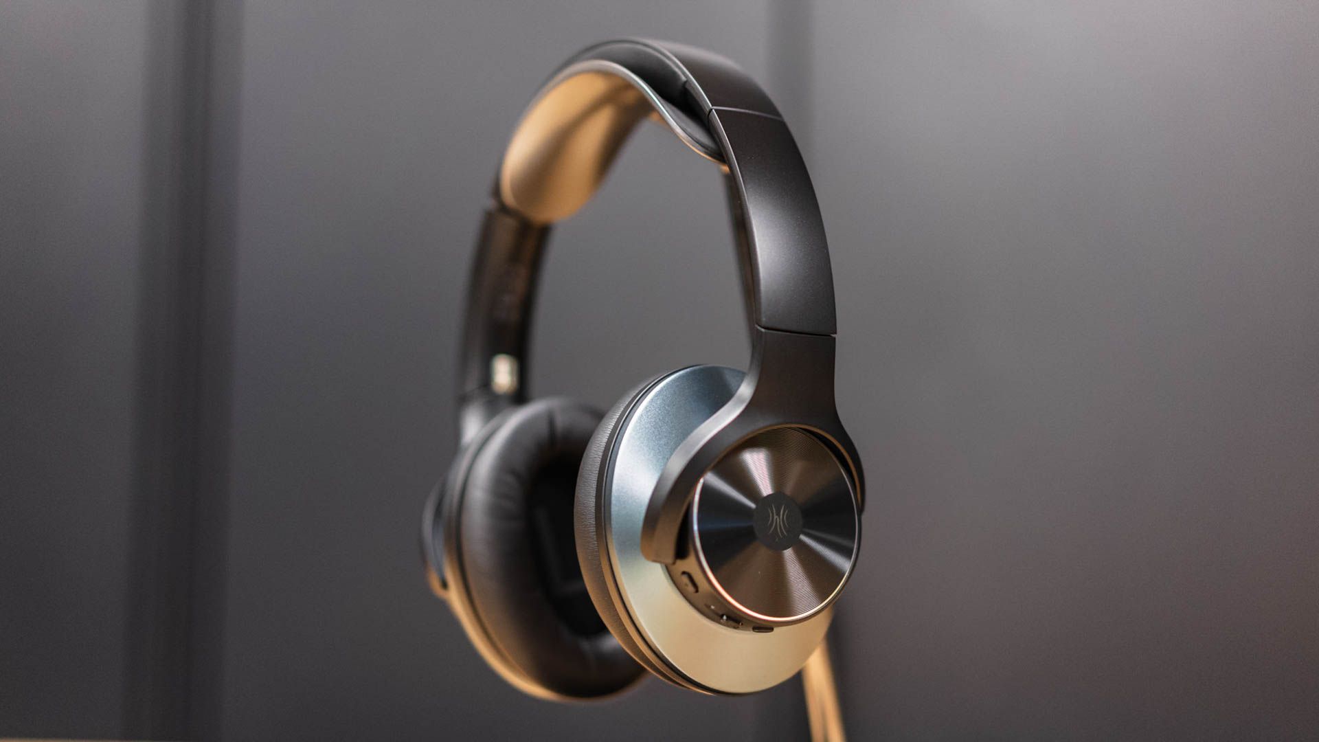 OneOdio A10 Hybrid Active Noise Cancelling Headphones on a headphone stand