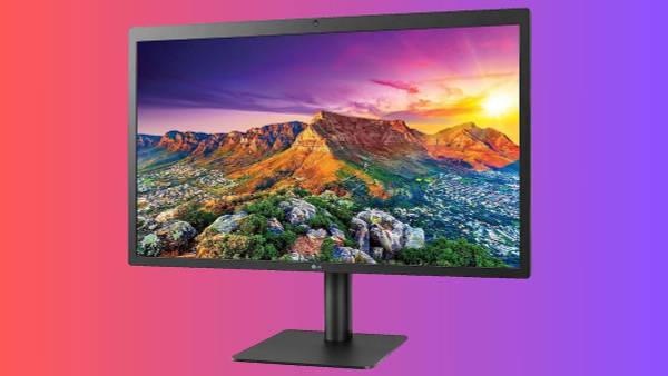 LG 27MD5KL-B 27-Inch UltraFine 5K Monitor on an ombre pink and purple background.