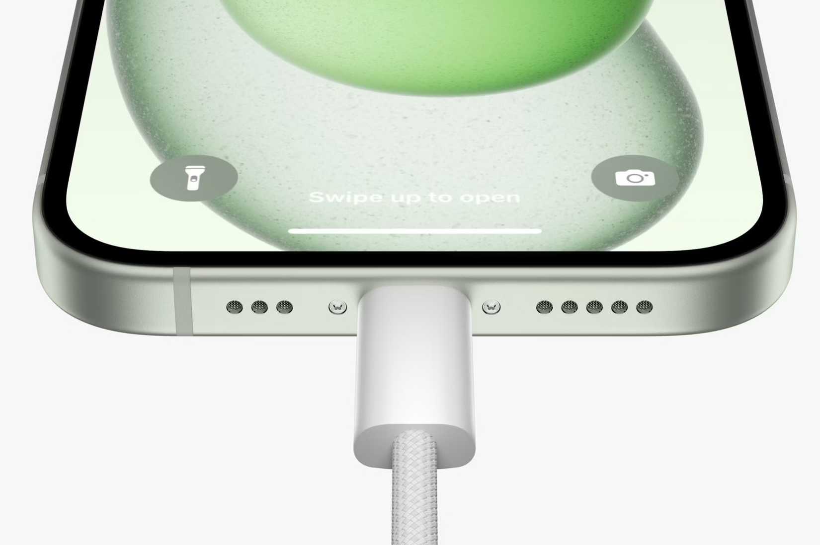 Closeup of a USB-C cable connected to the iPhone 15.