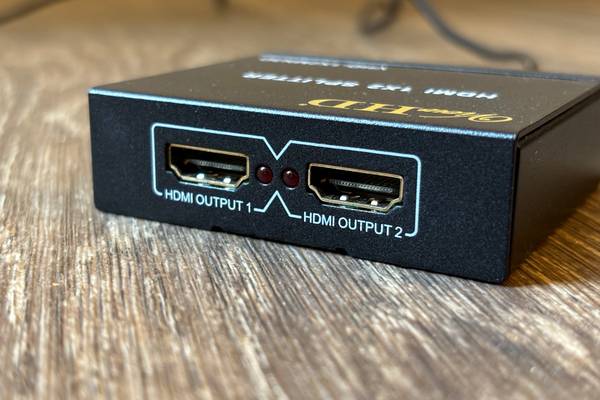 Closeup of two ports on an HDMI splitter. 