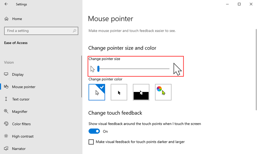 Drag the slider under "Change Pointer Size." 