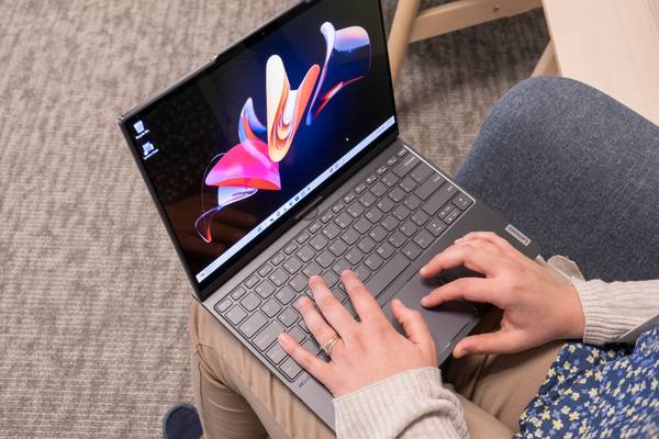 Lenovo ThinkBook Plus Gen 4 color display on a person's lap