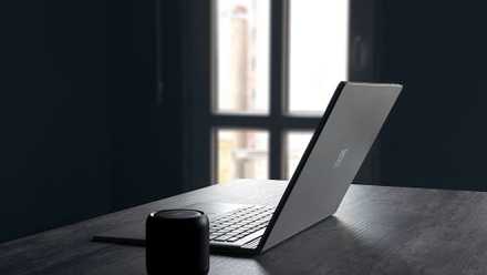 Google’s place of job apps are unfastened, however I nonetheless pay for Microsoft 365 for those 4 causes A Windows laptop next to a Bluetooth speaker on a table
