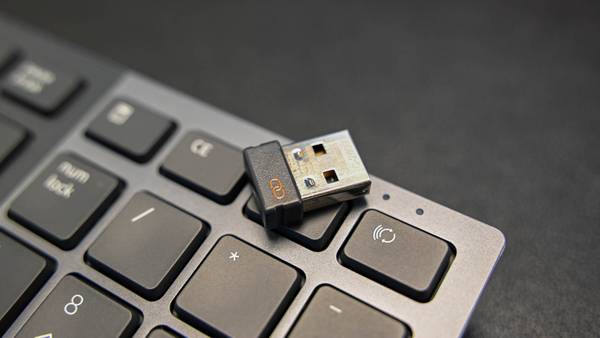 A Bluetooth adapter on a keyboard. 