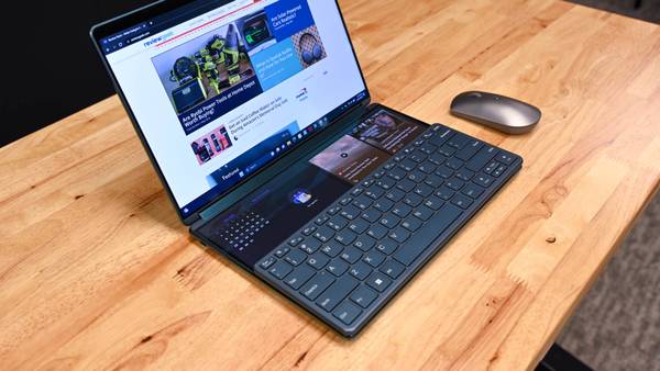 The Lenovo Yoga Book 9i with the physical keyboard and small windows on the bottom display