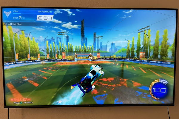 A picture of a TV with the game Rocket League displayed.