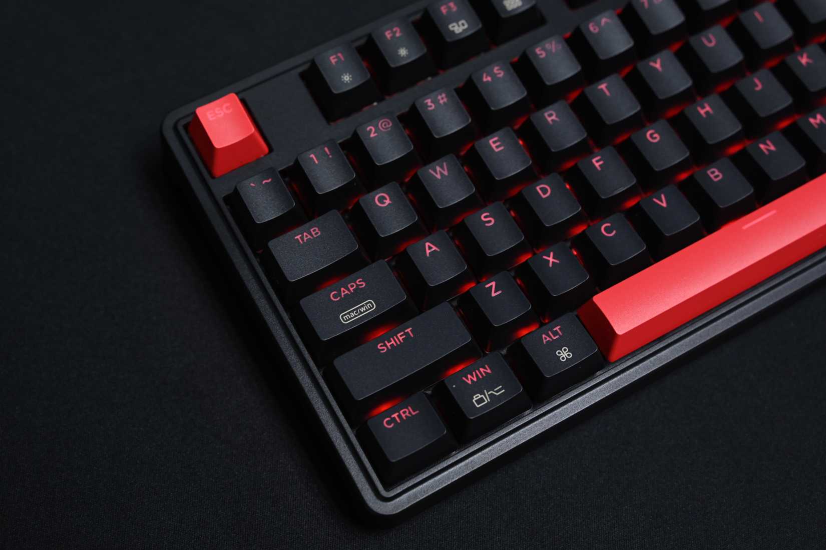 Keyboard with red Escape key and red Space bar. 