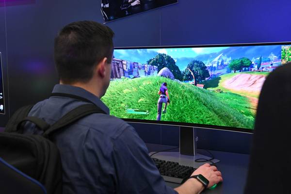 Person playing Fortnite on a Samsung Odyssey OLED G9 Curved Monitor at CES 2024