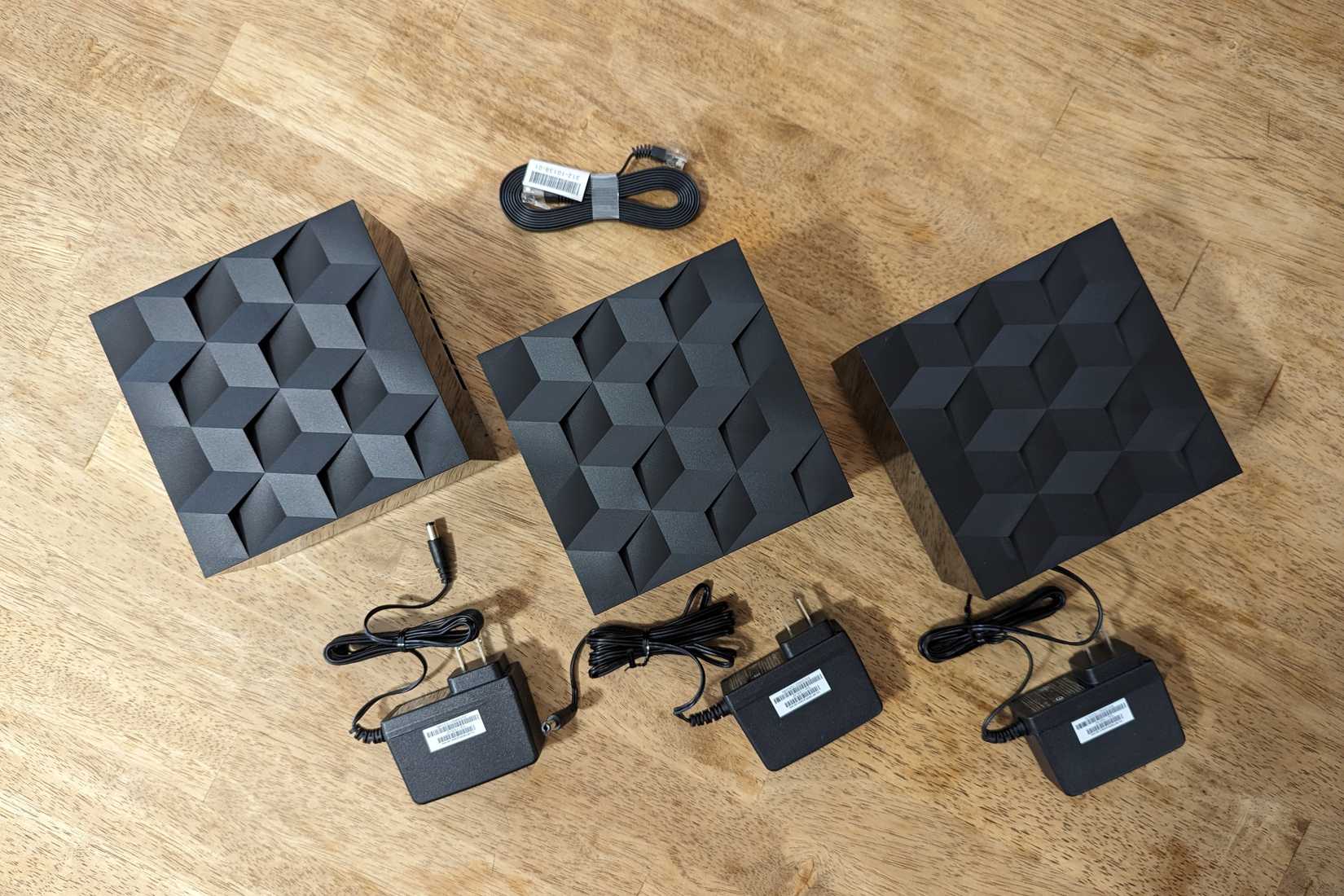 Top view of the contents of the box in the Netgear Nighthawk MK93S Tri-Band Mesh Wifi 6E System.