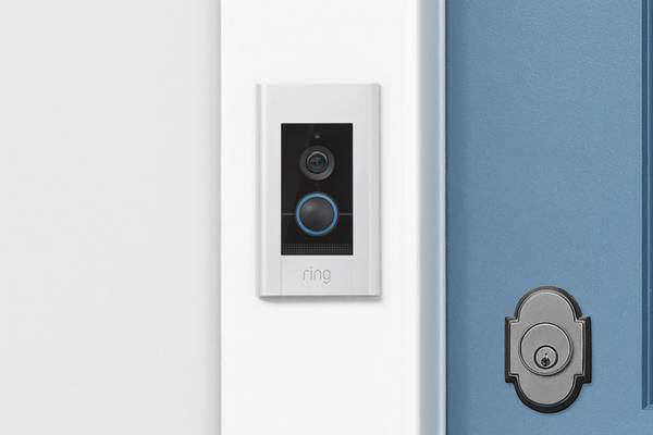 Ring video doorbell elite near a front door.