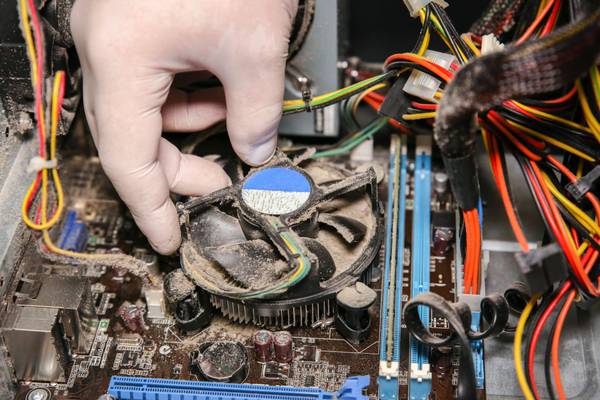 The internal components of an old, dusty computer.