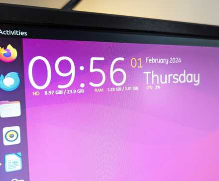 Top-left corner of an Ubuntu desktop with a Conky widget featuring date and time along with system stats.