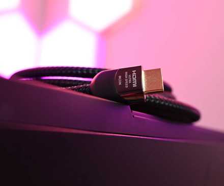 An HDMI cable laying on a computer.