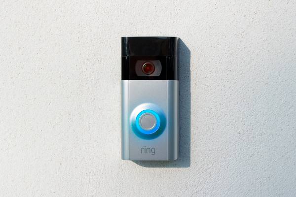 A Ring doorbell with the light on.