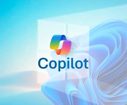 Copilot logo in the center with the Windows logo behind on a blue background.