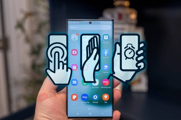A hand holding a Samsung Galaxy phone and three gesture icons in the center.