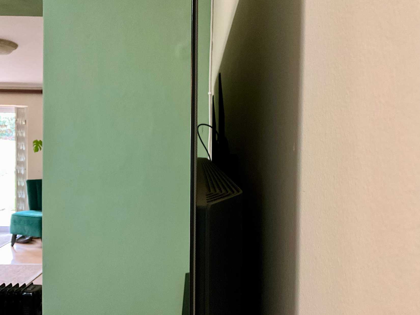 OLED TV with thin and thick parts on display.